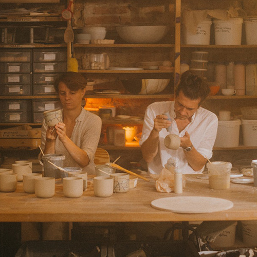 Two people doing pottery